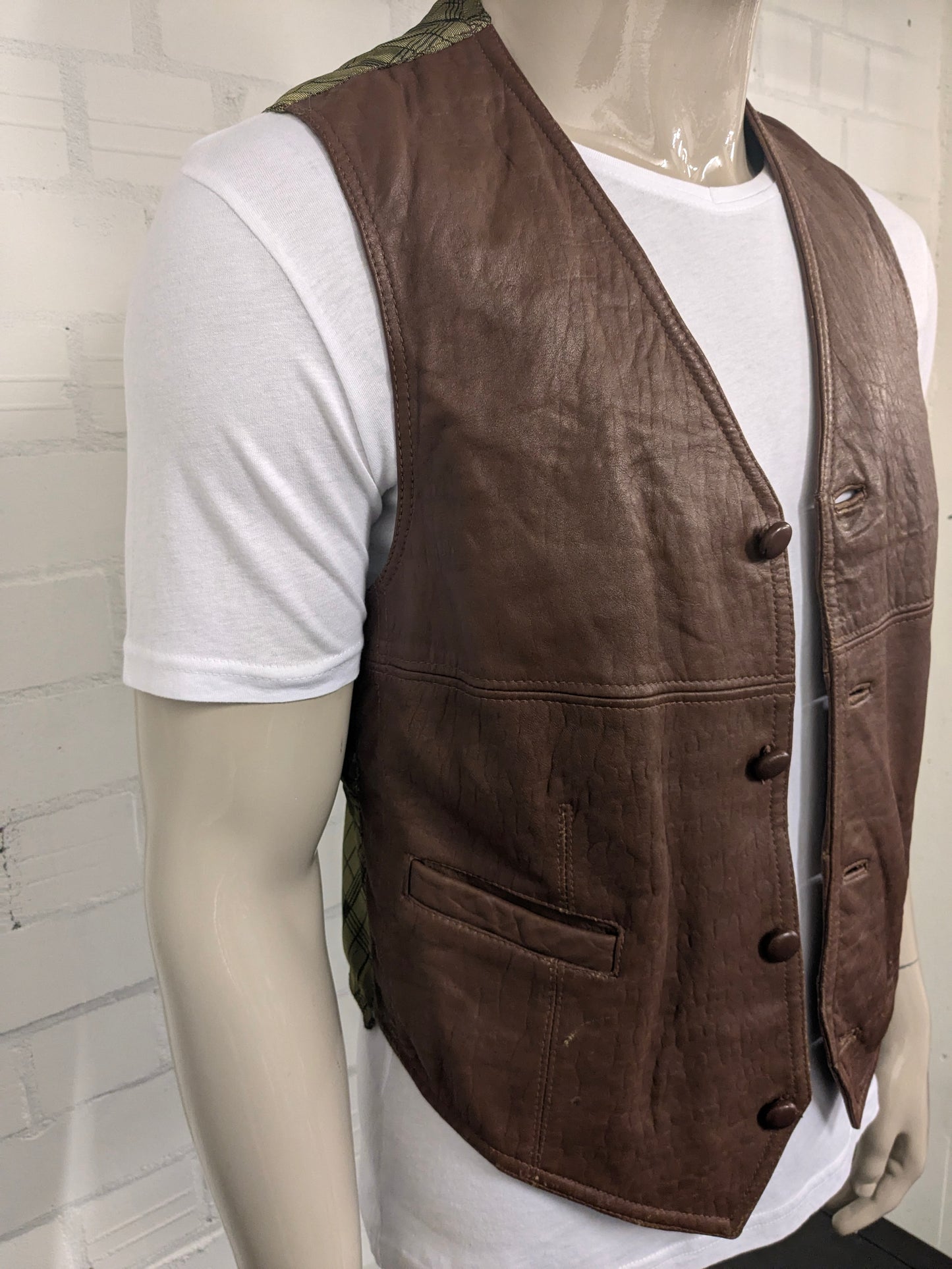 Giuta di cuoio vintage. Colorato marrone. Taglia M.