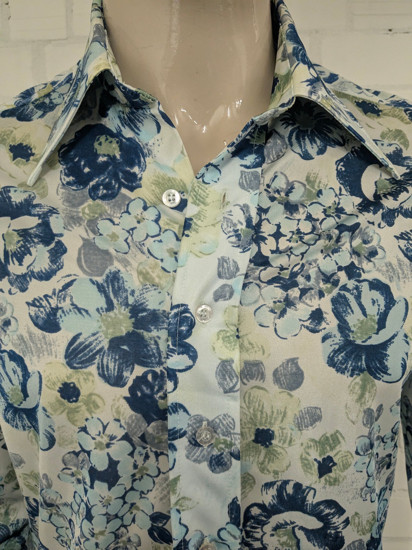 Vintage 70's cellini shirt with point collar. Blue green flowers print and slightly translucent. Size M.
