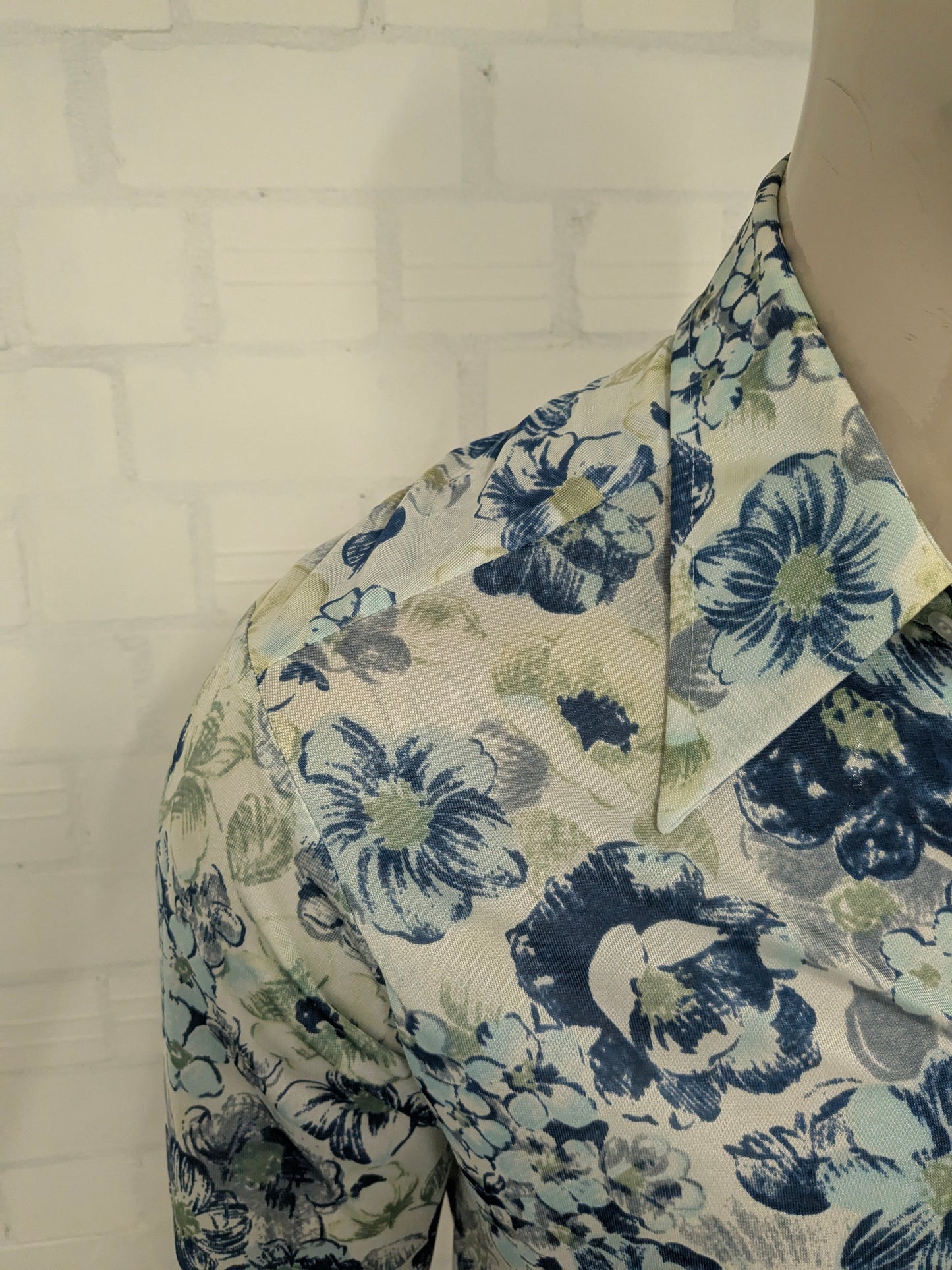 Vintage 70's cellini shirt with point collar. Blue green flowers print and slightly translucent. Size M.