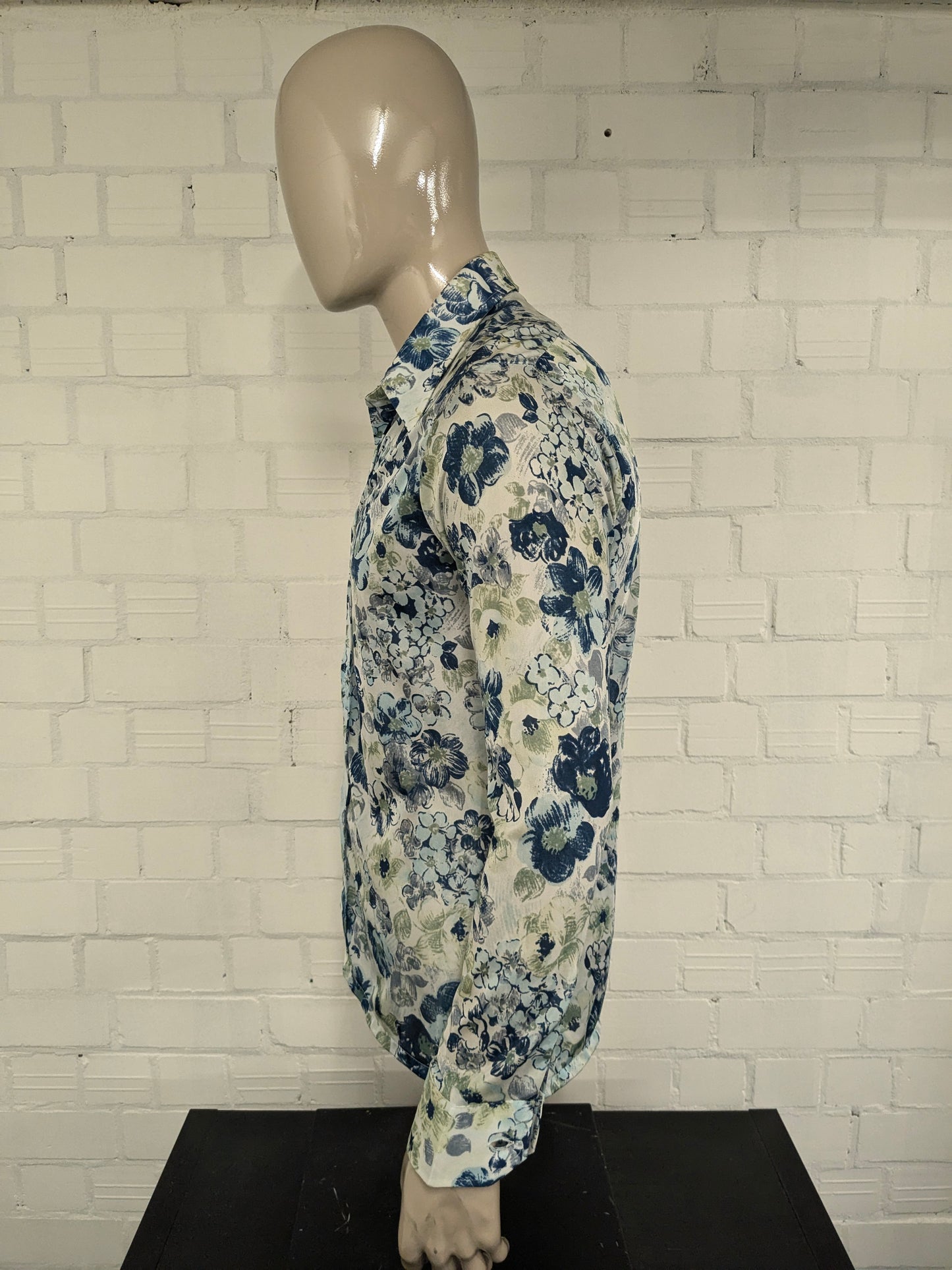 Vintage 70's cellini shirt with point collar. Blue green flowers print and slightly translucent. Size M.