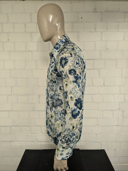 Vintage 70's cellini shirt with point collar. Blue green flowers print and slightly translucent. Size M.