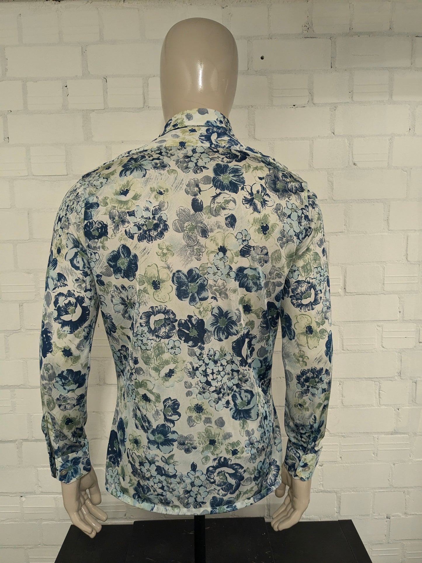 Vintage 70's cellini shirt with point collar. Blue green flowers print and slightly translucent. Size M.