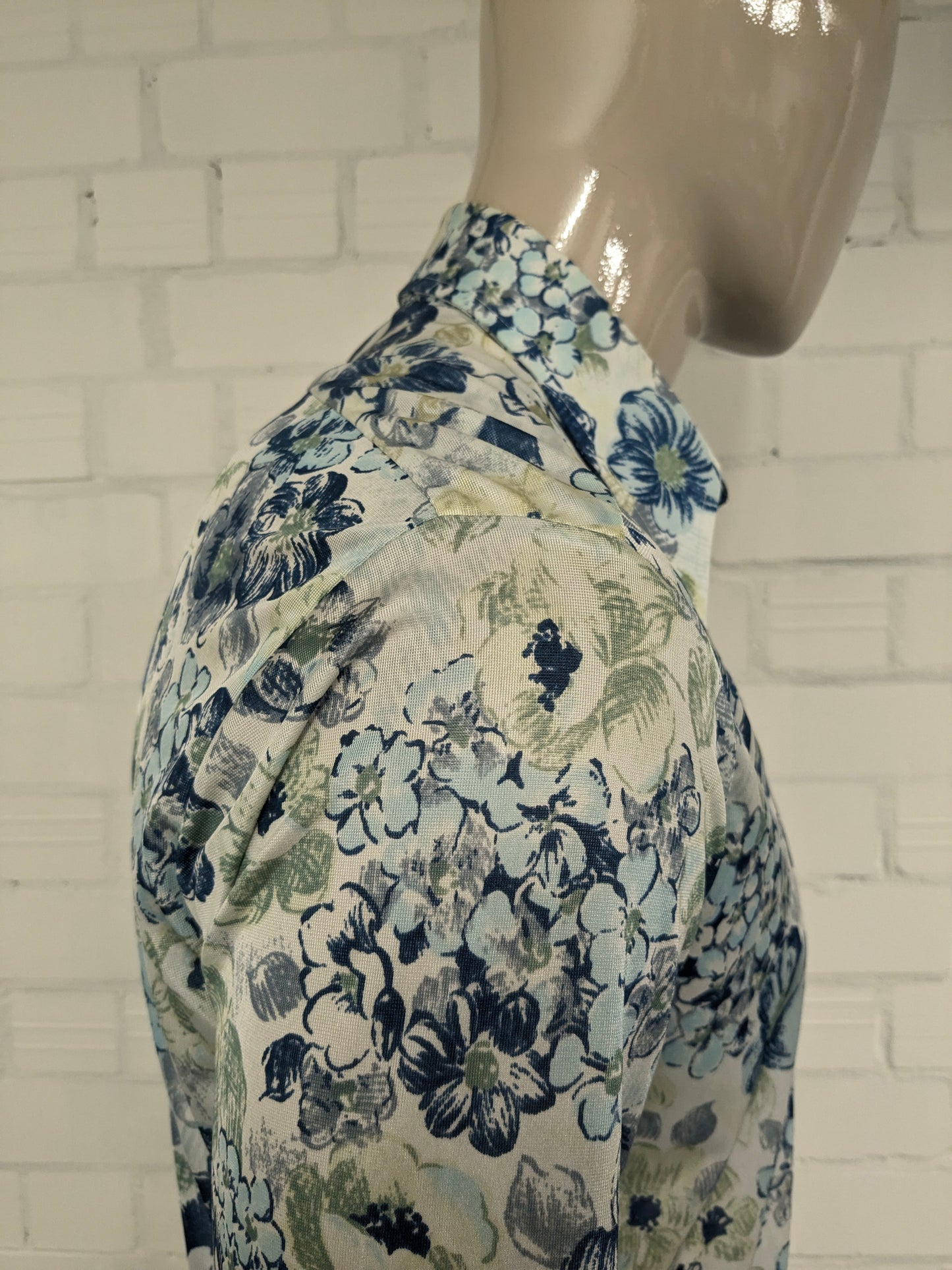 Vintage 70's cellini shirt with point collar. Blue green flowers print and slightly translucent. Size M.