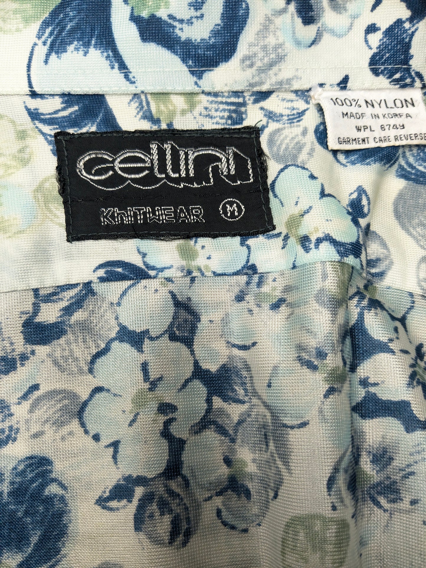 Vintage 70's cellini shirt with point collar. Blue green flowers print and slightly translucent. Size M.
