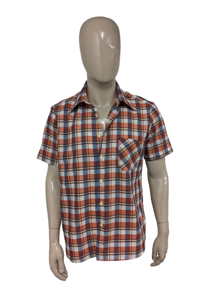 Vintage 70er TOM Hemd mit kurzen Ärmeln und spitzem Kragen. Rot Orange Beige Blau kariert. Größe L.