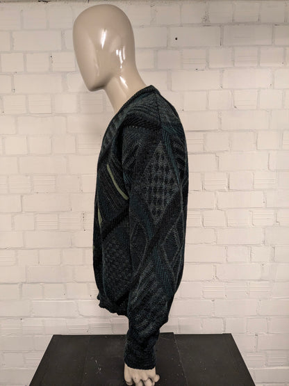 Vintage Angelo Litrico woolen sweater with V-neck. Green black colored. Size L. 8% wool.