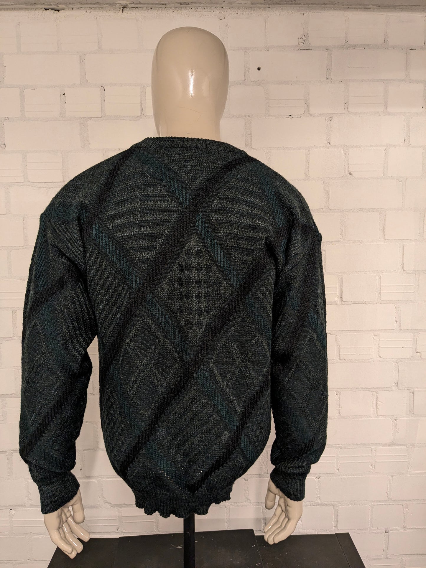 Vintage Angelo Litrico woolen sweater with V-neck. Green black colored. Size L. 8% wool.