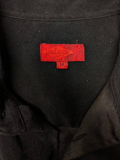Camisa Lee Cooper de manga corta. De color negro y se siente como gamuza. Talla M.