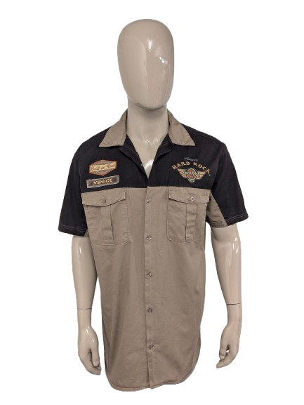 Original Hard Rock Cafe short sleeve shirt. Black Brown with applications. Size XL.
