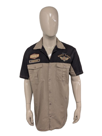 Original Hard Rock Cafe short sleeve shirt. Black Brown with applications. Size XL.