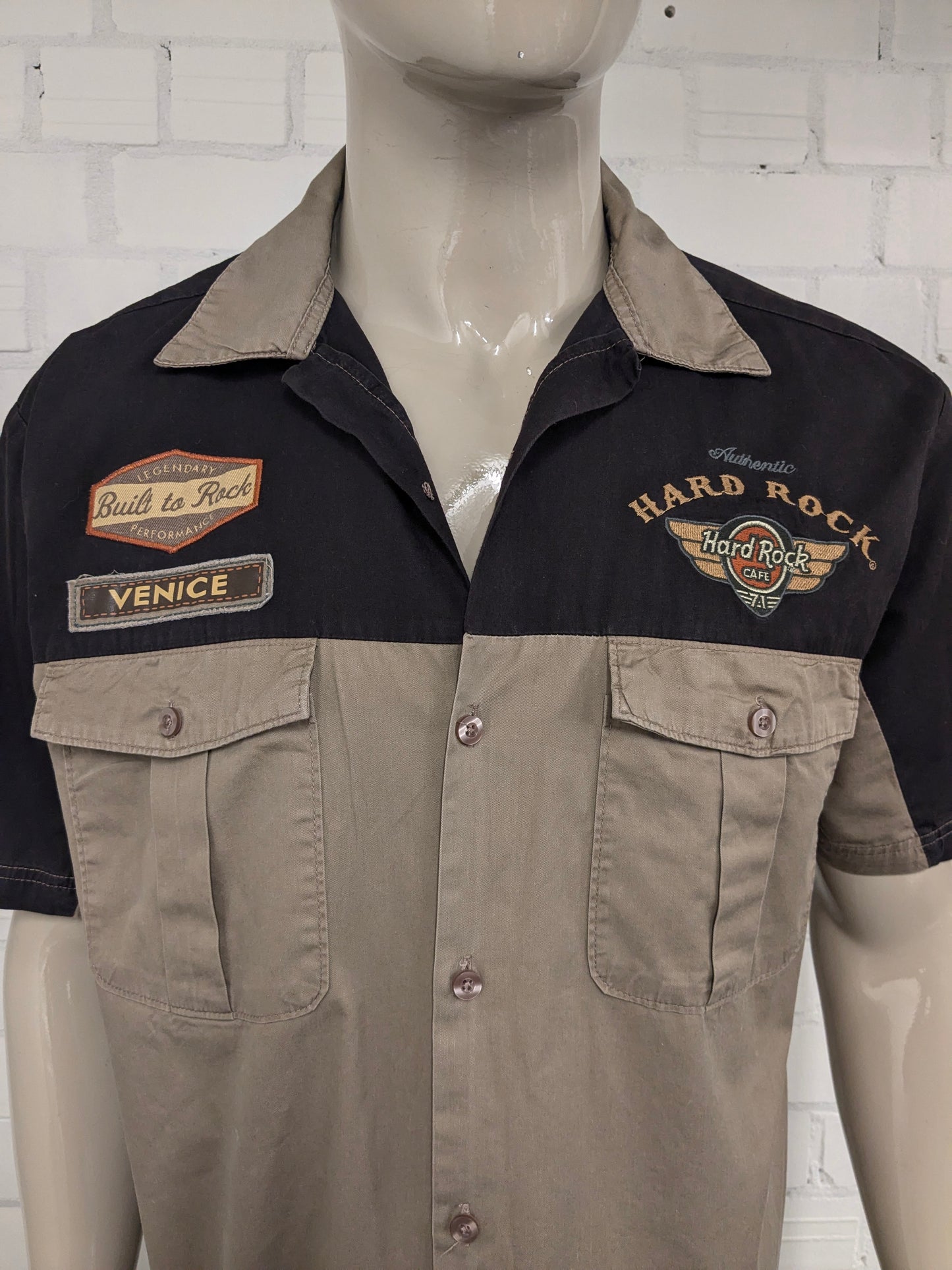 Original Hard Rock Cafe short sleeve shirt. Black Brown with applications. Size XL.