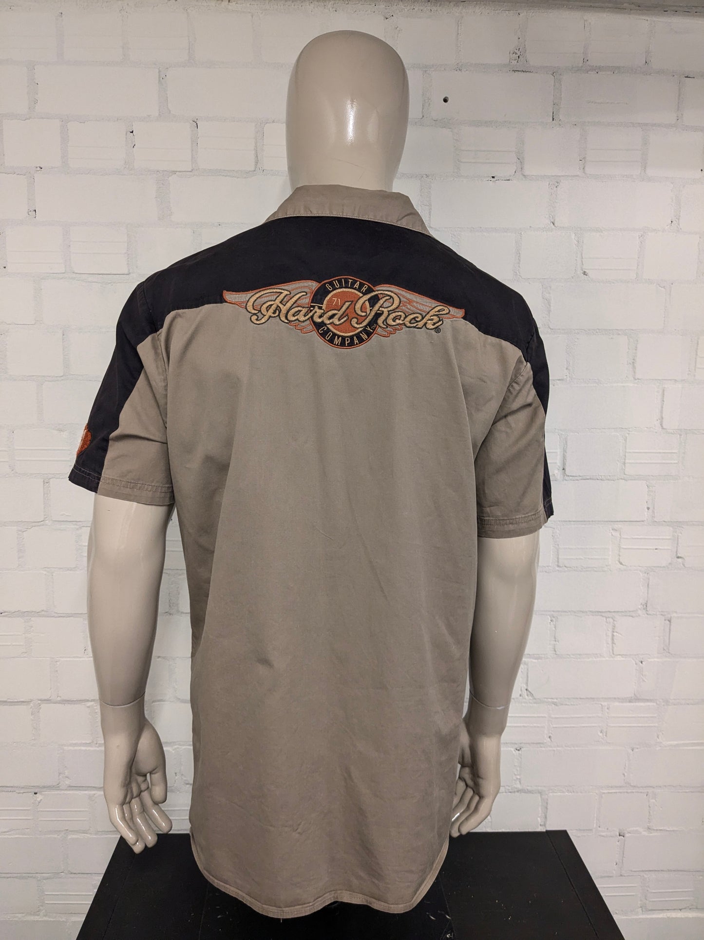 Original Hard Rock Cafe short sleeve shirt. Black Brown with applications. Size XL.