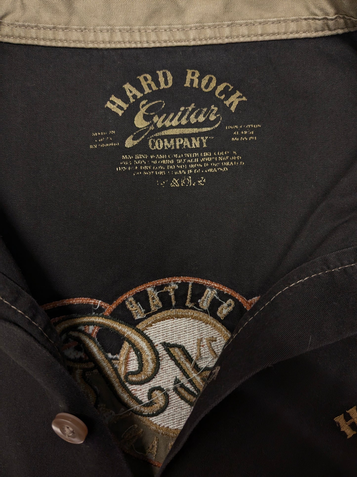 Original Hard Rock Cafe short sleeve shirt. Black Brown with applications. Size XL.