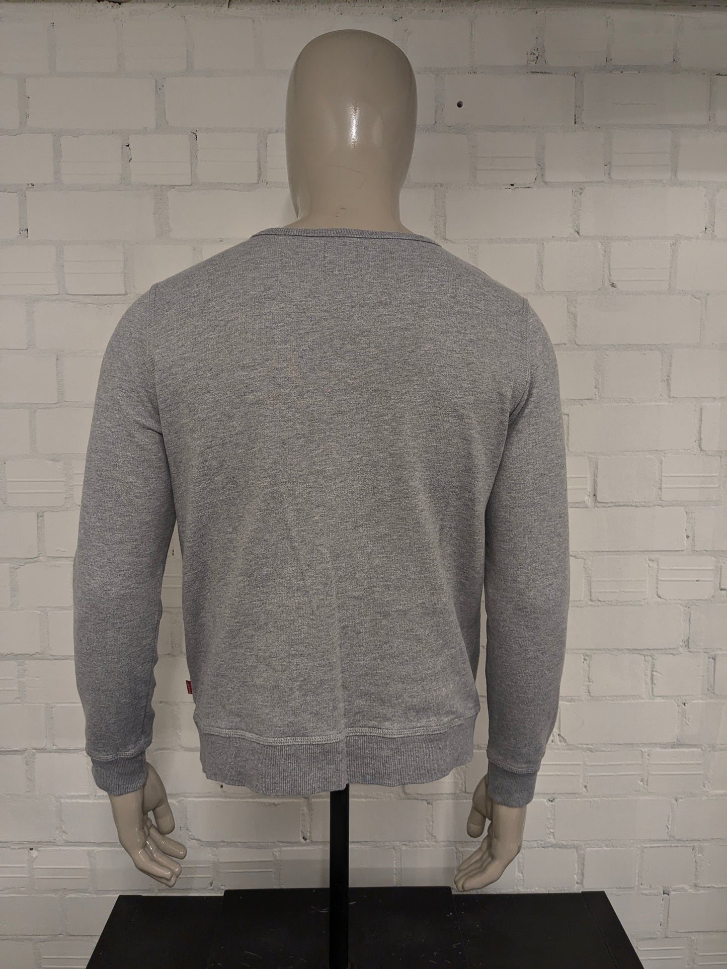 Le pull Levi's. Gris mélangé à de l'imprimé. Taille M.