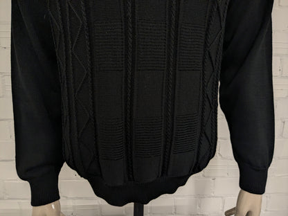 Pull en laine mérinos du Manitoba. Motif tactile noir. Taille L. 50% Laine.