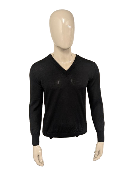 Top Man Woolen sweater with V-neck. Colored black. Size M. 100% Wool.