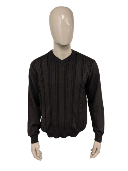 Pull Bartlett & Walker en laine mérinos avec col en V. De couleur marron bleu foncé. Taille L. 34% Laine.