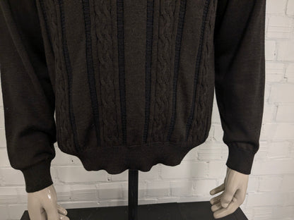 Pull Bartlett & Walker en laine mérinos avec col en V. De couleur marron bleu foncé. Taille L. 34% Laine.