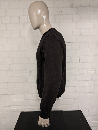 Pull Bartlett & Walker en laine mérinos avec col en V. De couleur marron bleu foncé. Taille L. 34% Laine.