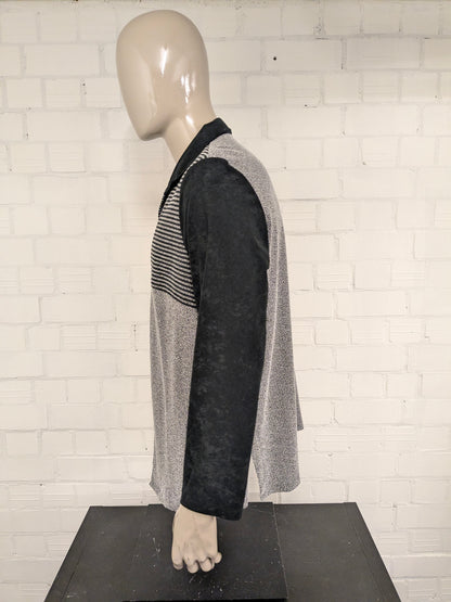Vintage Canda cardigan with zipper. Black and white colored. Size XL.