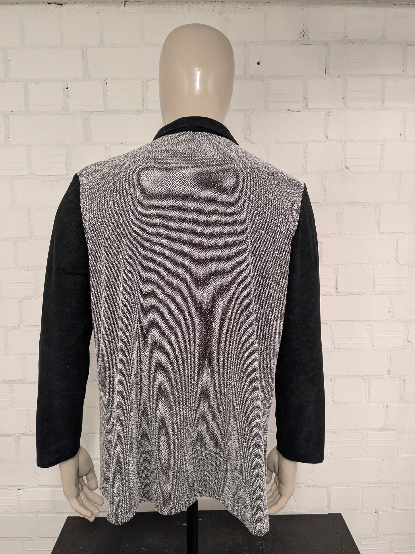 Vintage Canda cardigan with zipper. Black and white colored. Size XL.