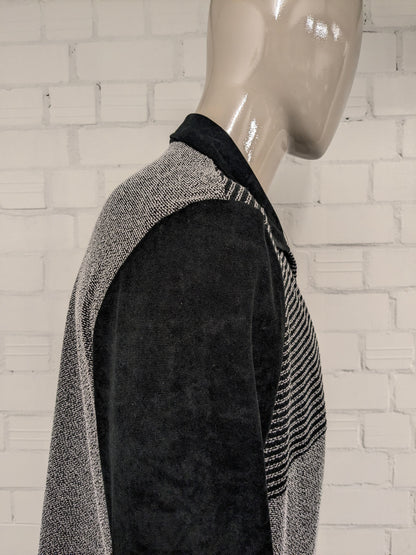 Vintage Canda cardigan with zipper. Black and white colored. Size XL.