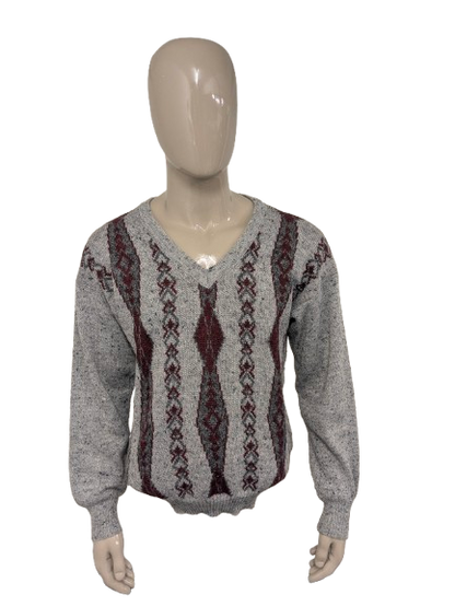 Maglione vintage Luis Ferrer in lana con scollo a V. Colore grigio rosso. Taglia L. 13% Lana.