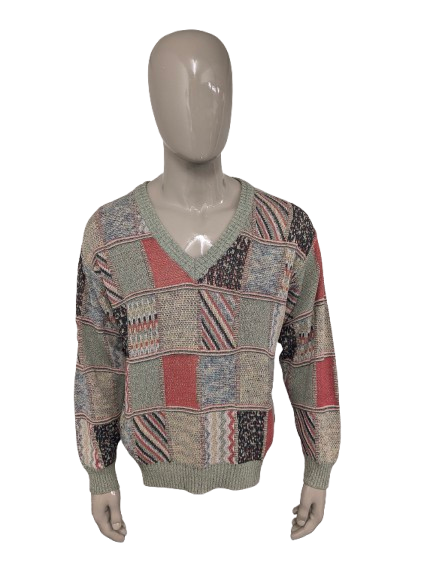 Maglione vintage Monte Carlo con scollo a V. Motivo colorato. Taglia L.
