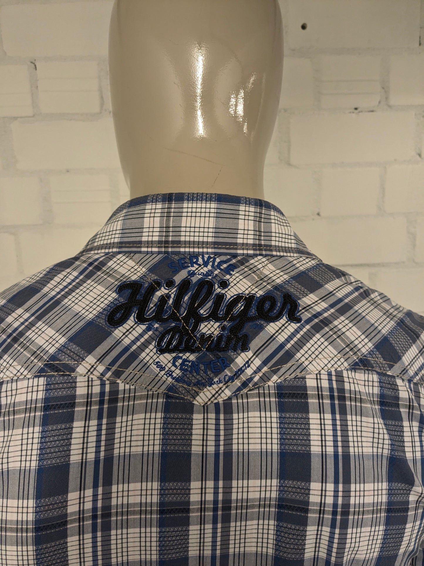 Hilfiger Denim shirt with press studs. Blue and white checked. Size S.