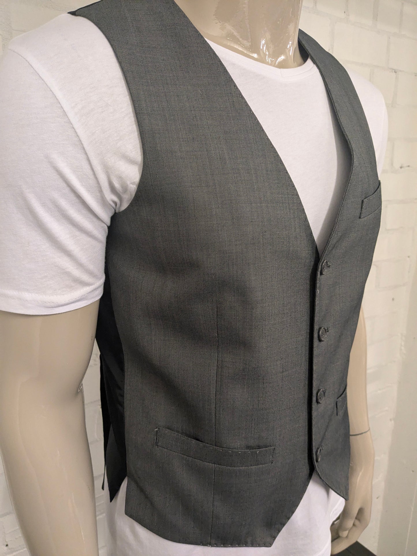 Chaleco Butler & Web. Motivo mixto gris. Talla M. Corte entallado.