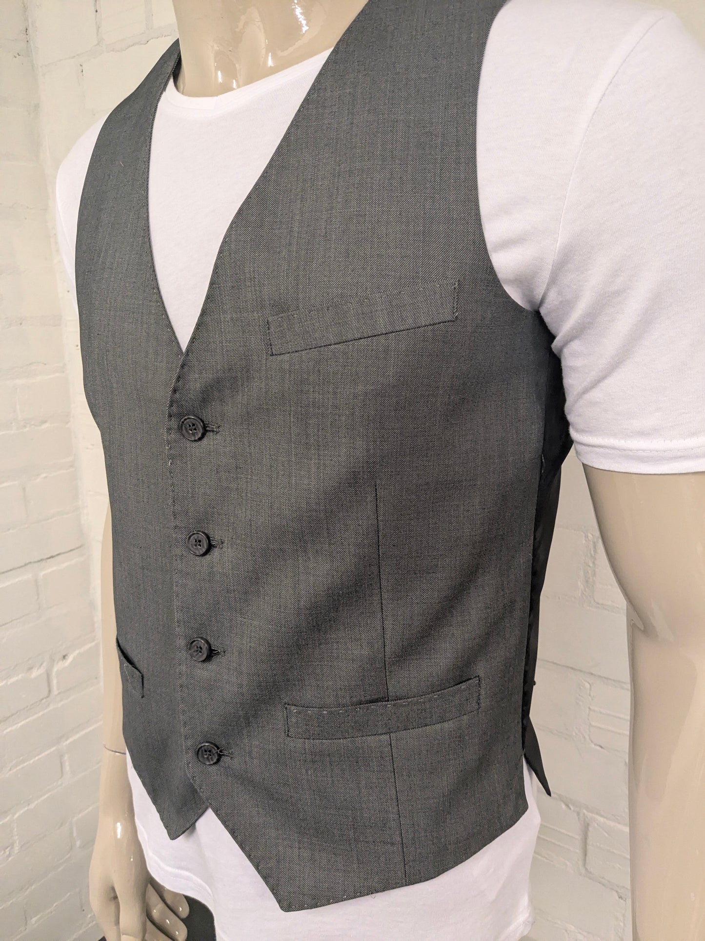 Chaleco Butler & Web. Motivo mixto gris. Talla M. Corte entallado.