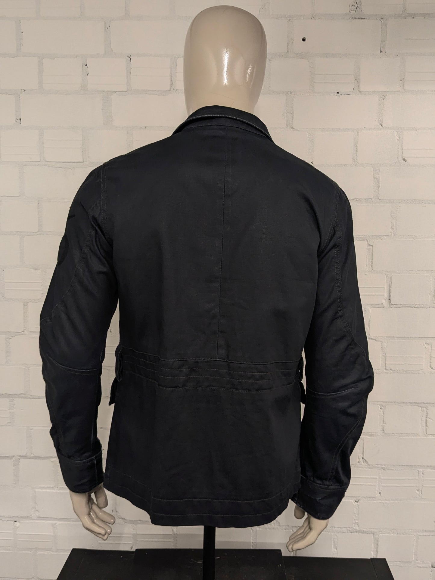 G-Star RAW between coat / jacket. Dark Blue colored. Size M.