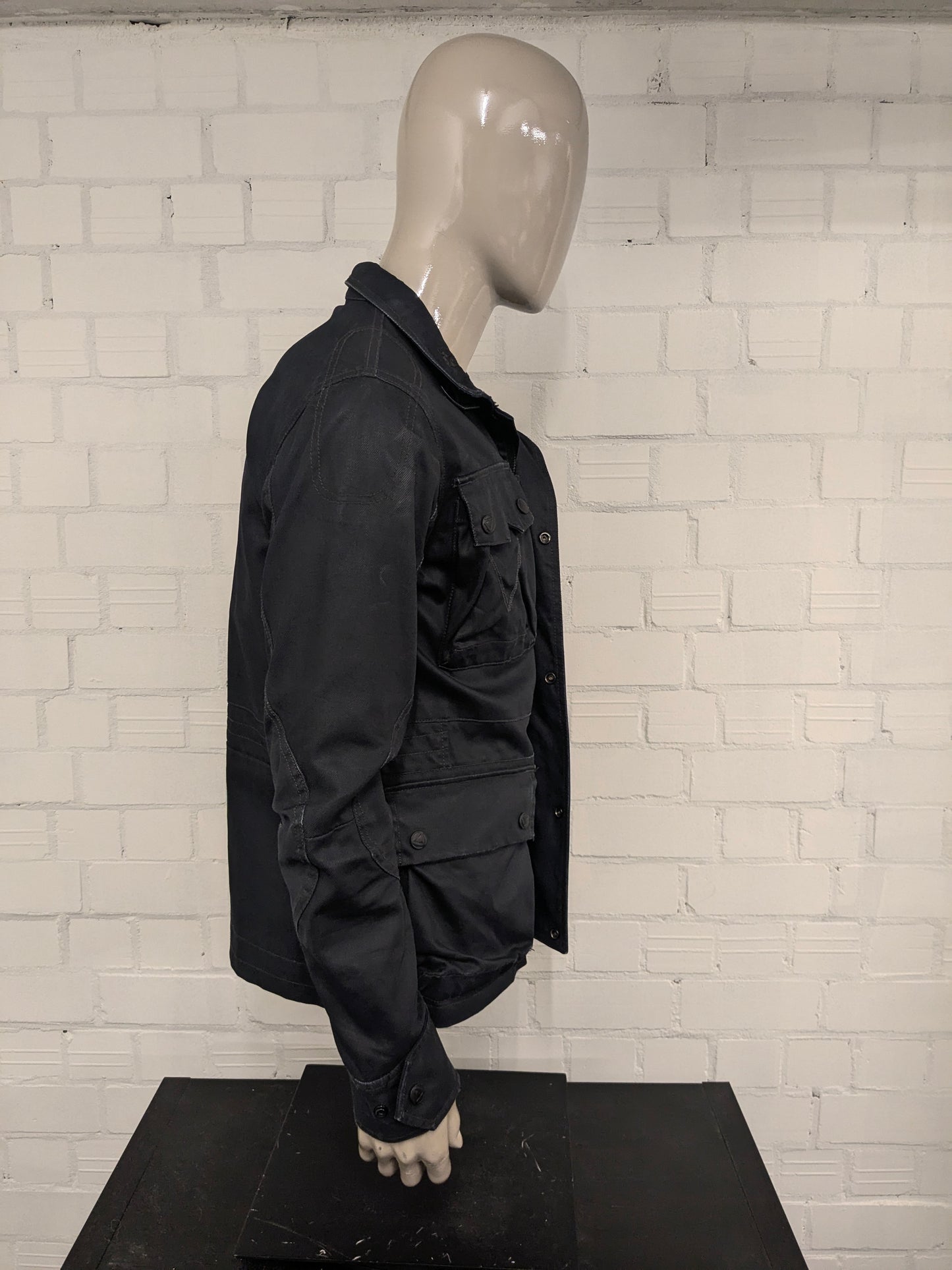 G-Star RAW between coat / jacket. Dark Blue colored. Size M.