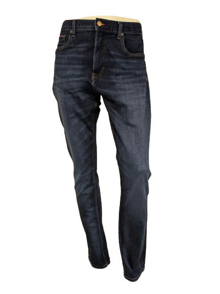 Tommy Hilfiger jeans. TH Flex. Dark Blue colored. Size W36 - L36. Houston stretch.