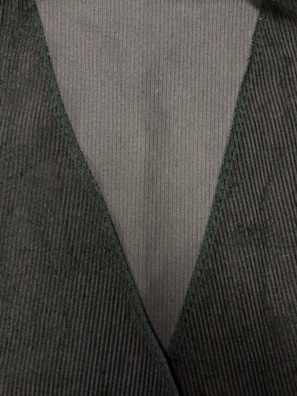 Vintage rib gilet zonder sluiting. Donker Groen gekleurd. Maat M / L.