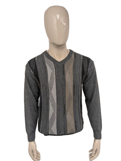 Maglione vintage in lana Trade Wind con scollo a V. Colore grigio kaki. Taglia M. 30% Lana.