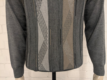 Maglione vintage in lana Trade Wind con scollo a V. Colore grigio kaki. Taglia M. 30% Lana.