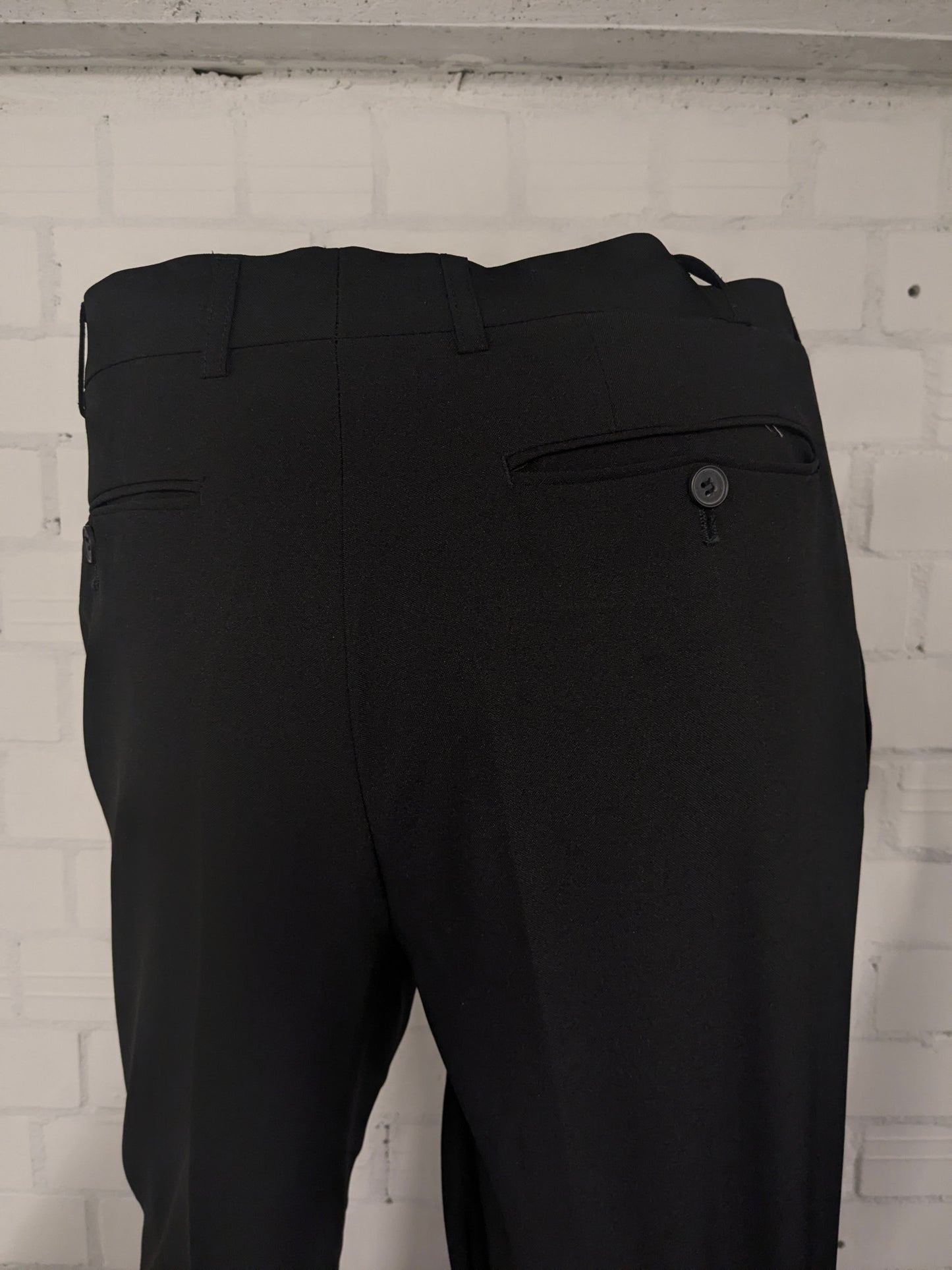 Travelmaster kostuum. Zwart gekleurd. Maat 94 (48 / M).