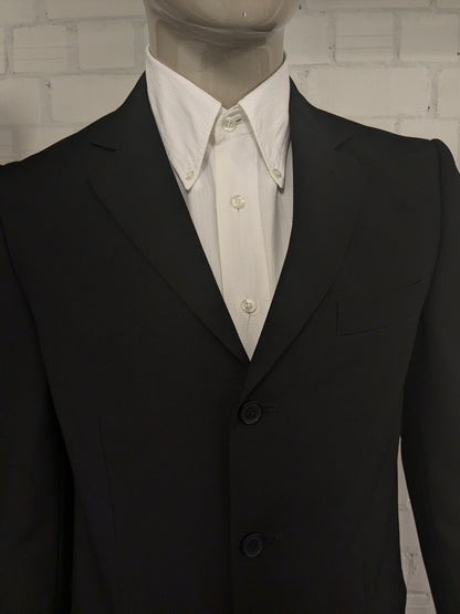 Travelmaster kostuum. Zwart gekleurd. Maat 94 (48 / M).