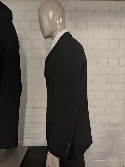 Travelmaster kostuum. Zwart gekleurd. Maat 94 (48 / M).