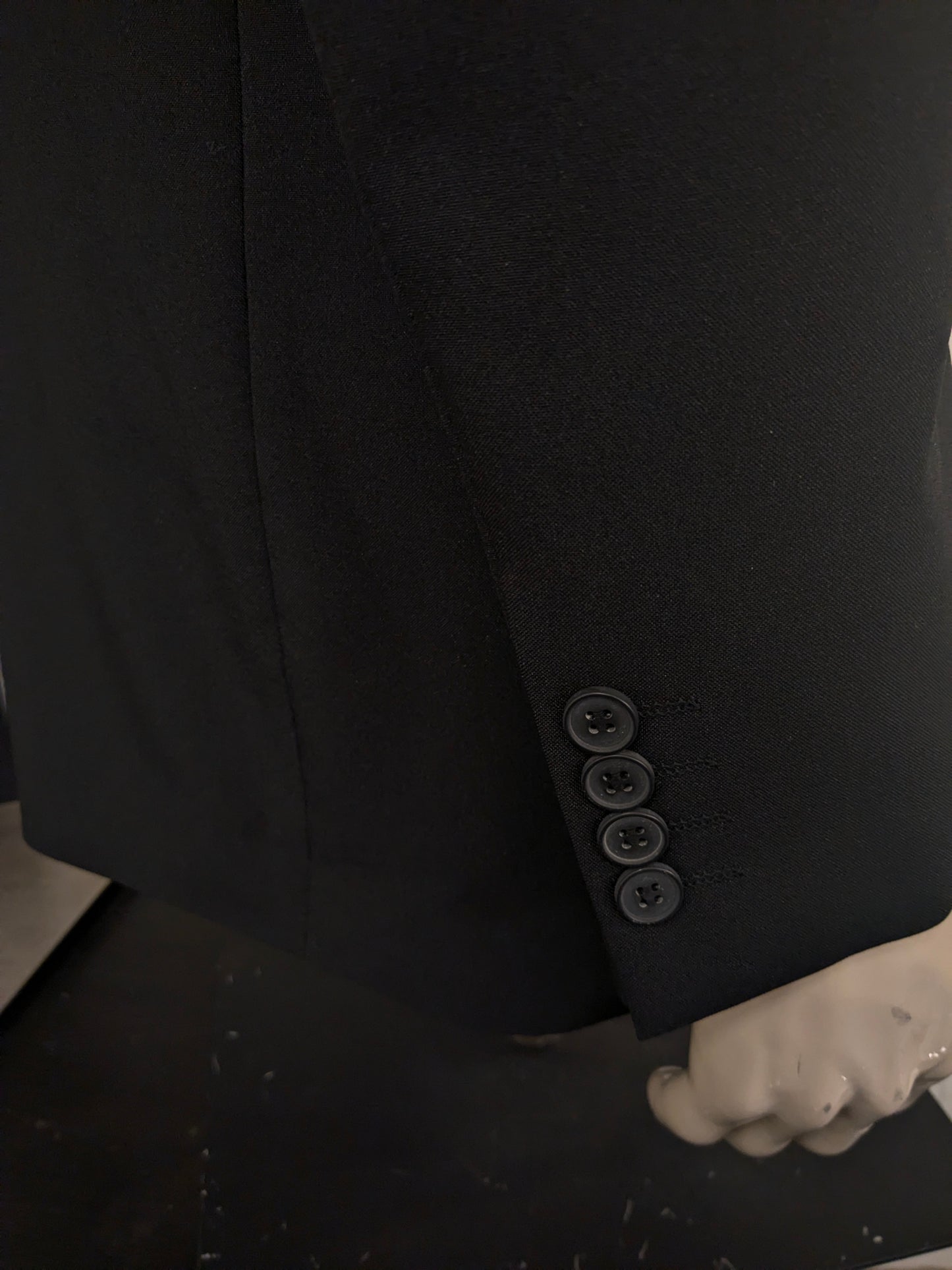 Travelmaster kostuum. Zwart gekleurd. Maat 94 (48 / M).