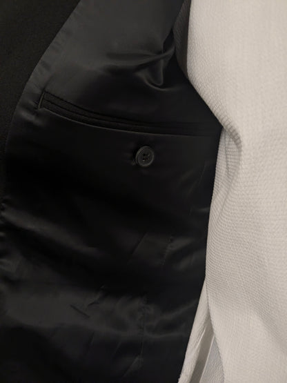 Travelmaster kostuum. Zwart gekleurd. Maat 94 (48 / M).