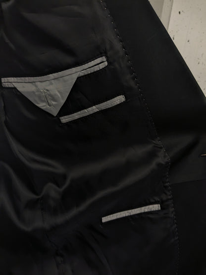 Smoking/vestito. Di colore nero. Taglia 60.