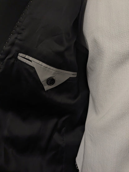 Smoking/vestito. Di colore nero. Taglia 60.