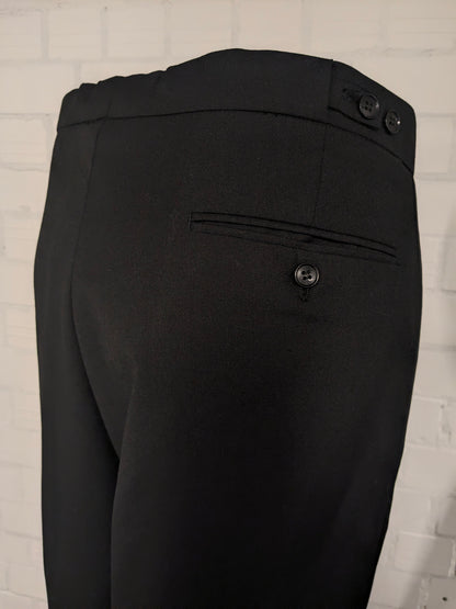 Smoking/vestito. Di colore nero. Taglia 60.