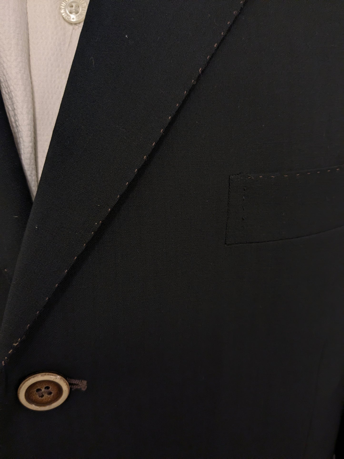 Giacca in lana Pal Zileri. Nero con cuciture marroni. Taglia 58/XL.