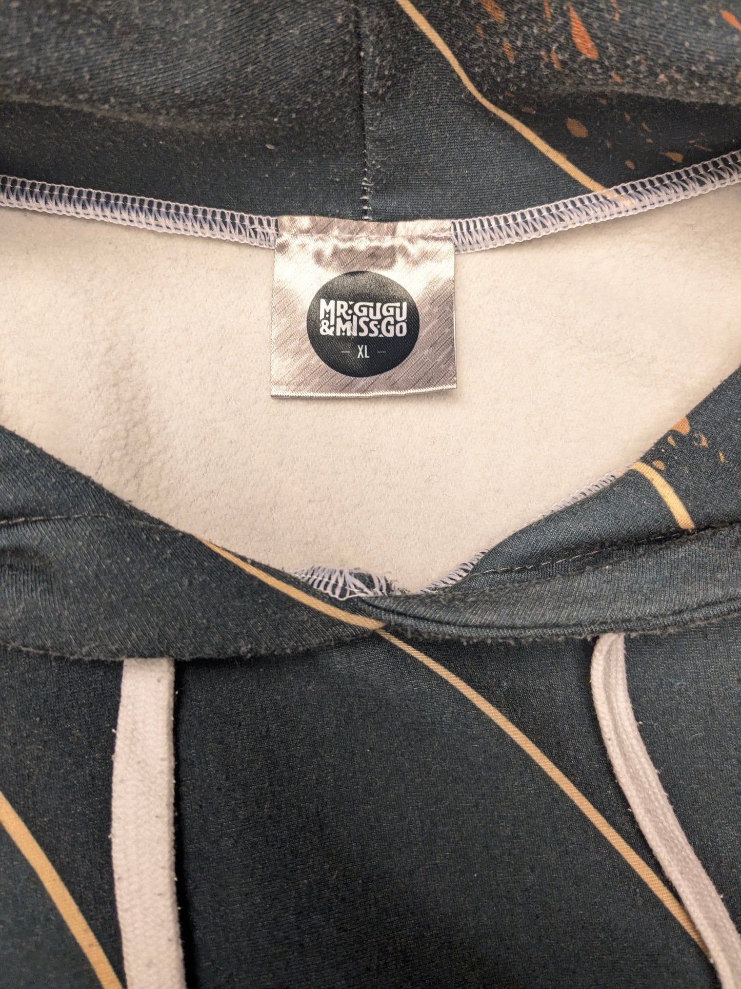 Mr Gugu & Miss Go hoodie. Green Gold colored print. Size XL.