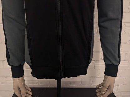 Sketches vest met capuchon. Wit Grijs Zwart gekleurd. Maat S.