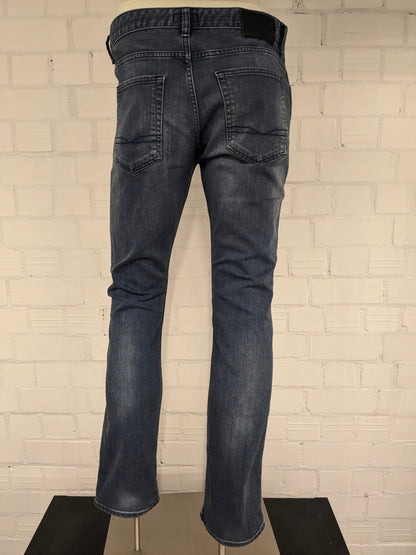 Boss Hugo Boss jeans. Donker Blauw gekleurd. Maat W34 - L32. type Delaware Slim Fit. stretch.