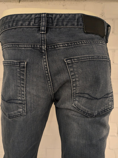 Boss Hugo Boss jeans. Donker Blauw gekleurd. Maat W34 - L32. type Delaware Slim Fit. stretch.